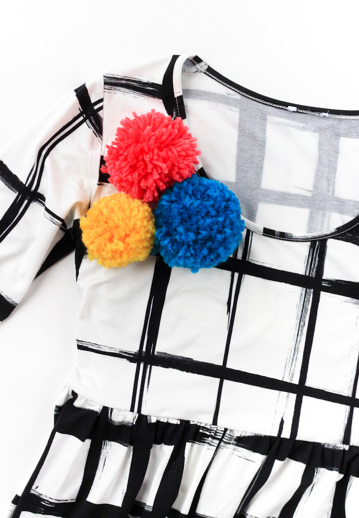 Add a pop of color to any outfit in 15 minutes with these DIY Pom Pom Brooches!