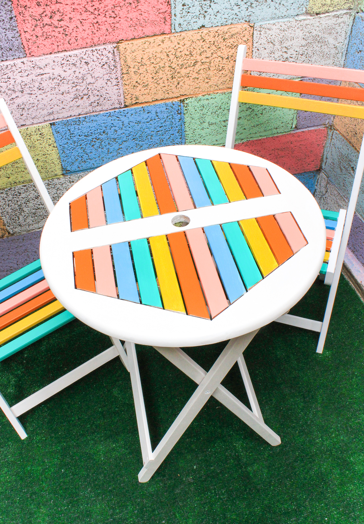 With just a bit of paint, you can make a cheap bistro set feel like you're in Palm Springs! Add a little rainbow to your patio decor with this DIY Table Makeover!
