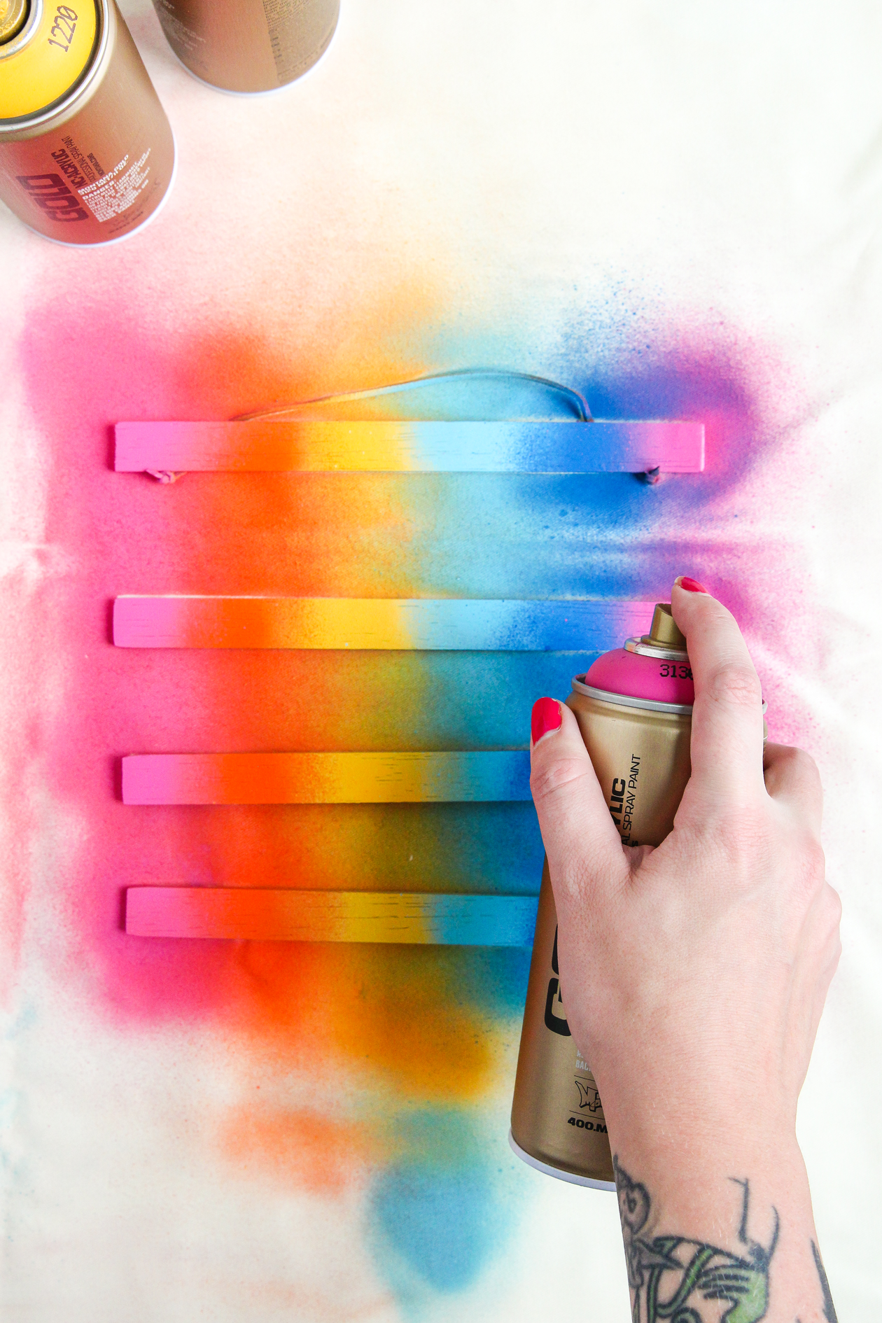 Learn how to make this DIY Rainbow Poster Hanger in just 10 minutes!