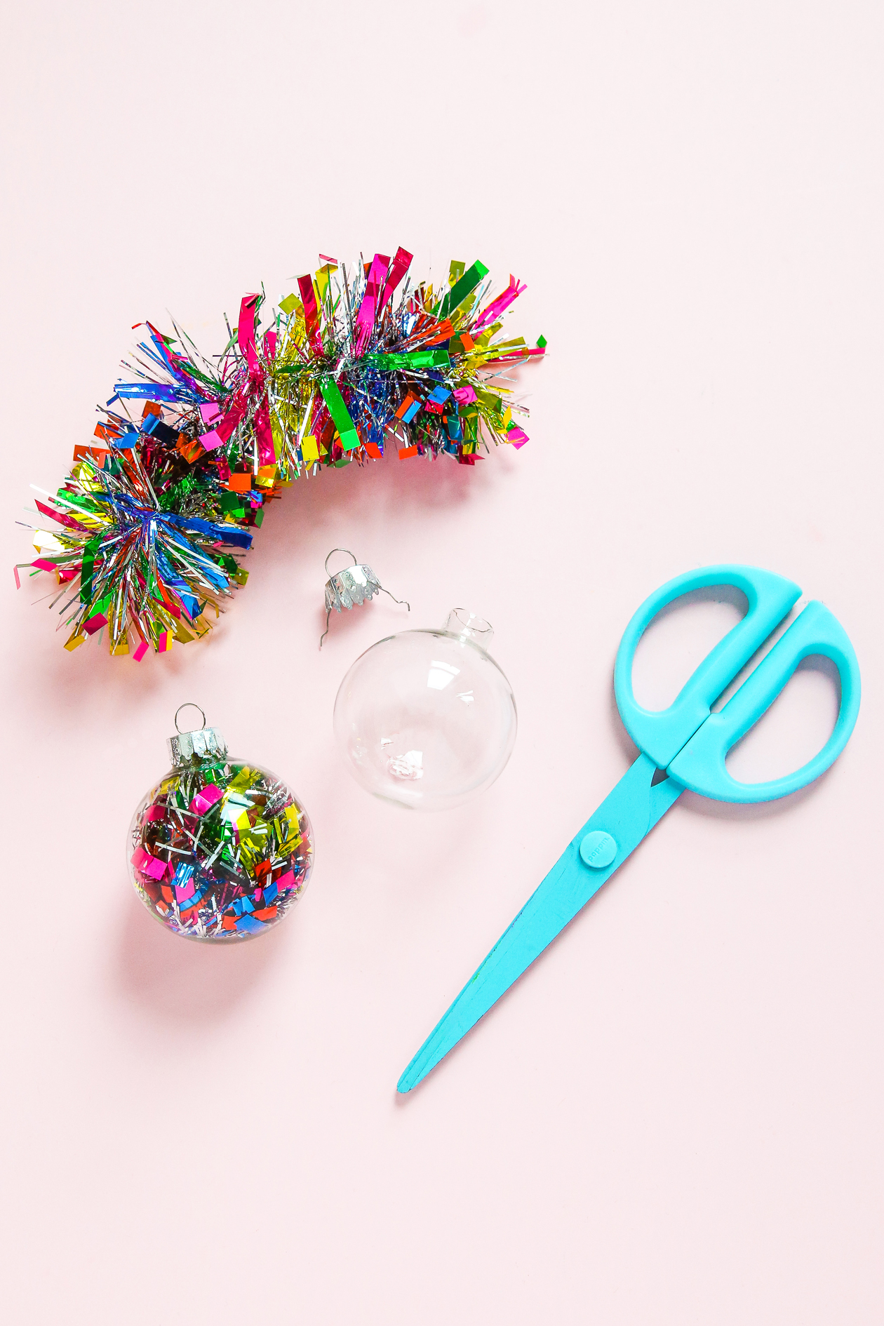 Looking for a quick Christmas craft?! You can make this DIY Tinsel Ornament in 10 minutes to less! Great for colorful Christmas decor and a great holiday upcycle project!