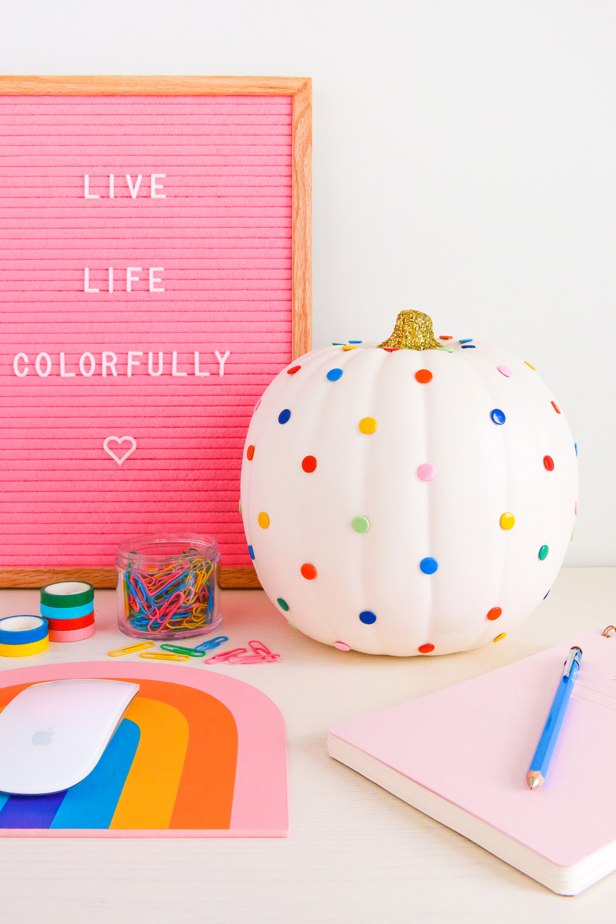 Looking for ways to decorate pumpkins for Halloween or fall? Make this DIY Push Pin Pumpkin in a few minutes! It's cute, colorful, functional, and perfect for Halloween!