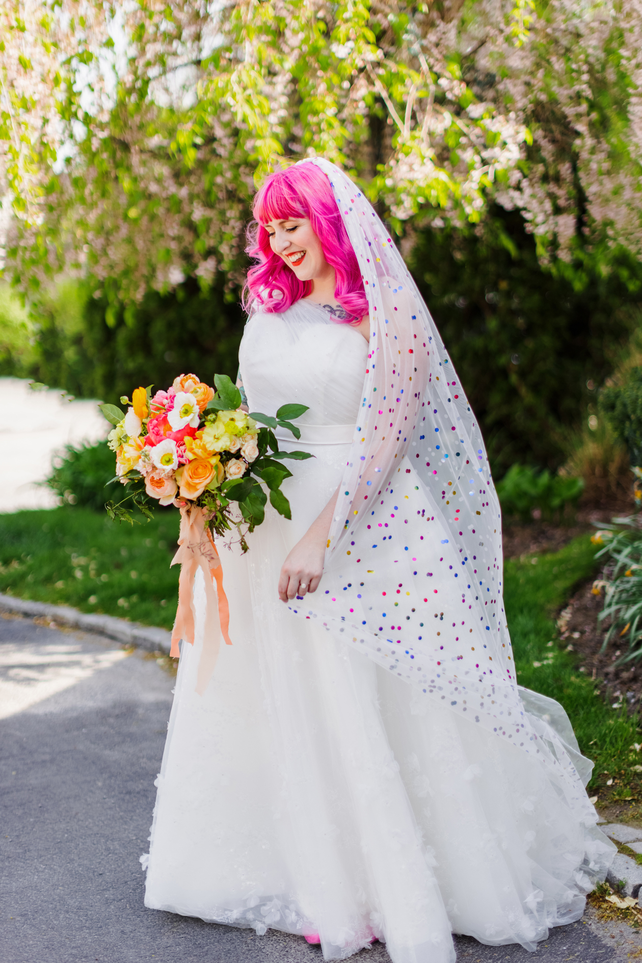 Add color to your wedding by wearing a confetti veil! Not only is it a unique veil but it goes with any wedding dress.