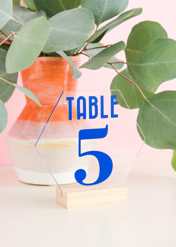 Learn how to make your own colorful wedding decor with this table number download! Grab the SVG file then start crafting your wedding decor today!