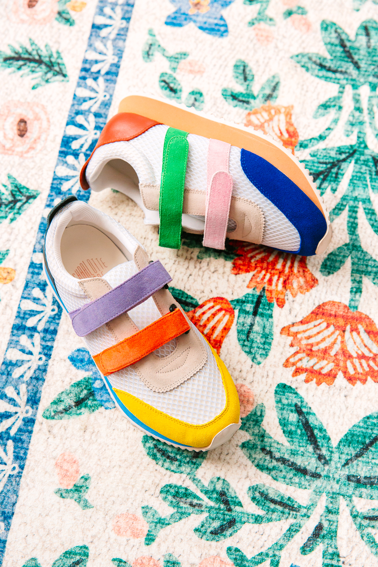 Colorful-Shoes Colorful Sneakers on a flower rug